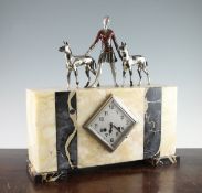 A French Art Deco onyx and marble clock, with central lozenge shaped dial and twin train movement,