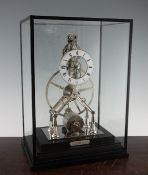 A Comitti of London chrome plated Great Wheel skeleton clock, with Roman dial and movement no.