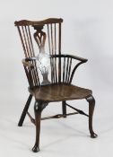 A late 18th century Thames Valley fruitwood and elm comb back Windsor chair, on cabriole legs