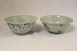 Four Chinese Ming blue and white bowls, Wanli period, the first painted to the exterior with