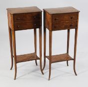 A pair of Edwardian satinwood side tables, each fitted with two drawers, with bun handles, on