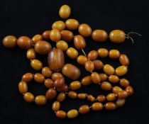 A single strand graduated oval yellow amber bead necklace, gross 140 grams, string broken, 48in
