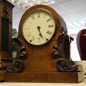 A Victorian walnut mantel clock, with arched scroll case, 14.5in.