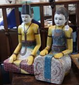 A pair of Indonesian polychrome and carved wood wedding figures, Java, 20th century, each seated