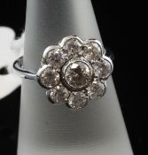 An 18ct white gold and diamond cluster ring, of flowerhead design, with an estimated total diamond