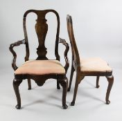 A set of eight 18th century style Dutch oak dining chairs, two with arms, six single, with vase