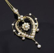 An Edwardian 15ct gold and split pearl pendant brooch, of open heart form, with a fine link chain