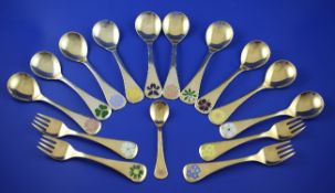 A small group of modern Georg Jensen sterling silver gilt and enamel annual commemorative spoons,