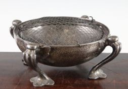 Oliver Baker for Liberty & Co. A Tudric circular pewter bowl, on four scroll legs, stamped marks