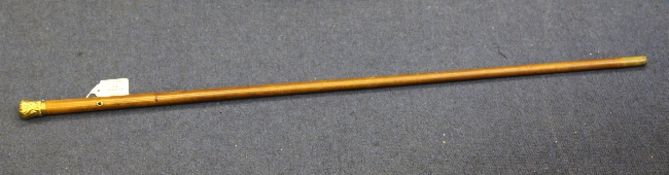 An Edwardian malacca walking cane, with embossed unmarked gold handle engraved Marlborough Club SW,