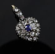 An Edwardian gold and silver, rose cut diamond and sapphire set heart shaped pendant, with glazed