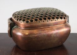 A Chinese copper bronze hand warmer, 18th / 19th century, of typical cushion form with a basket