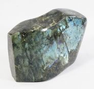 A polished labradorite specimen, the sculptural form displaying blue and green luminescent