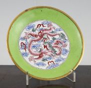 A Chinese Canton enamel `dragon` dish, 18th/19th century, painted with a five claw dragon chasing a