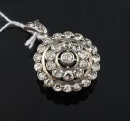 A white gold and diamond target pendant brooch, the pierced setting set with thirty two round cut