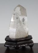 A Chinese scholar`s rock and rosewood stand, 18th / 19th century, the facetted rock crystal boulder