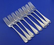 A set of eight Victorian silver hanovarian pattern dessert forks by George Adams, with engraved
