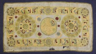 An early 20th century Turkish silk embroidered rectangular panel, with central Tugra motif within a