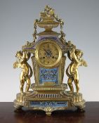 A 19th century French ormolu and champleve enamel mantel clock, with architectural case flanked by