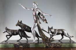 A French Art Deco silvered and bronzed metal group of a running woman and three hounds, signed A.