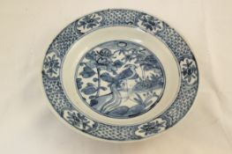 Two Chinese blue and white dishes, Swatow 17th century, the first painted to the centre with two