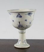 A Chinese Ming blue and white stem cup, 16th century painted with two figures on a hilltop with