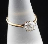An 18ct gold and solitaire diamond ring, the old cut stone weighing approximately 0.70ct, size L.