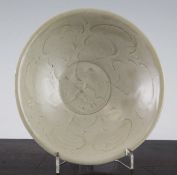 A Chinese Ding ware shallow bowl, Song Dynasty the interior incised with a flowerhead, unglazed