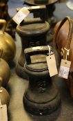 A Victorian black painted cast iron bell weight, 56lb, together with another similar bell weight,