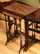 A 19th century mahogany and boxwood strung nest of three tables, with tapering ring turned