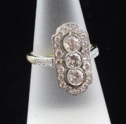 An Art Deco style 18ct gold and diamond cluster up-finger ring, with an estimated total diamond
