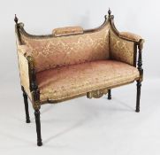 An Edwardian mahogany ivory and boxwood marquetry inlaid boudoir settee, with scrolling arms and