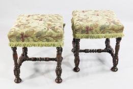 Two similar 18th century stained beech frame stools, with overstuffed needlework seats and turned