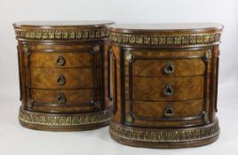 A pair of 20th century continental elm and parcel gilt D shaped commodes, each fitted with three