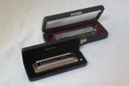 A Hohner Amadeus Chromatic harmonica, with original case, together with a Hohner 270 Deluxe