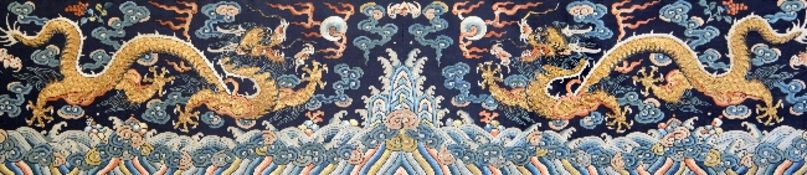 A Chinese embroidered silk and metal thread `dragon` panel, late Qing dynasty, finely woven with a