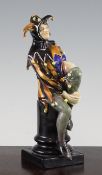 A Royal Doulton figure `A Jester`, HN1295, modelled by C J Noke, c.1928, inscribed and printed