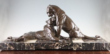 Attributed to Rochard. A French Art Deco bronzed spelter group of two panthers, on coloured marble