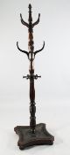 A late Victorian mahogany hall stand, with turned central column and upright projecting coat hooks,