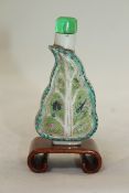 A Chinese famille rose `artemisia leaf` snuff bottle, painted with crickets and butterflies, the