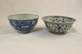 Three Chinese blue and white bowls, Wanli period, the first painted with lotus flowers and