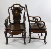 A set of six late 19th / early 20th century Chinese rosewood elbow chairs, with cartouche shaped