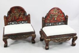 A pair of Indonesian polychrome wood ceremonial circumcision chairs, Madura, 19th century, the