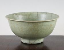 A Chinese Longquan celadon bowl, 15th century, with an everted rim and raised foot, unglazed burnt