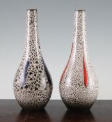 A pair of rare Poole pottery bottle shape vases, c.1970, one with a brown and blue mottled glaze,