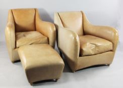 A pair of modern tan leather club style armchairs, with single matching footstool