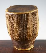 A late 19th / early 20th century African skin and hide hand drum, of typical form, 12in.
