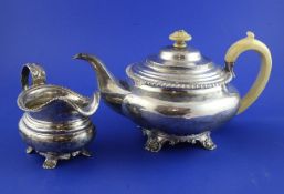 A William IV silver teapot, of squat circular form, with engraved monogram and ivory knop and