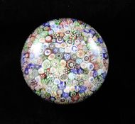 A Baccarat millefiori paperweight, c.1841, the closely packed complex cane rods including picture