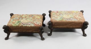 A pair of 19th century rectangular needlepoint foot stools, each projecting leg carved as lion